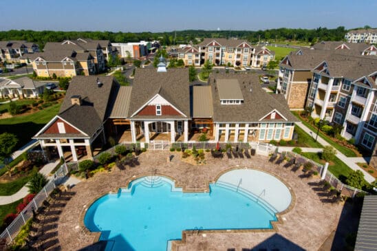 Aerial view of apartment complex with swimming pool