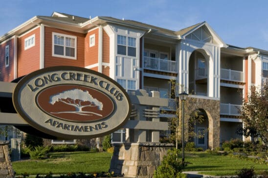 Long Creek Club Apartments exterior with sign