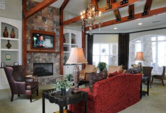 Elegant living room with red sofa and fireplace
