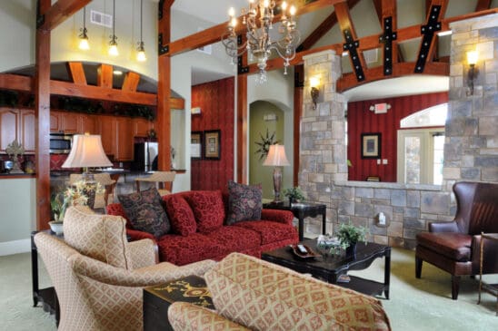 Elegant living room with red sofa and stone accents