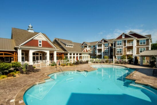 Apartment complex with outdoor swimming pool and clubhouse