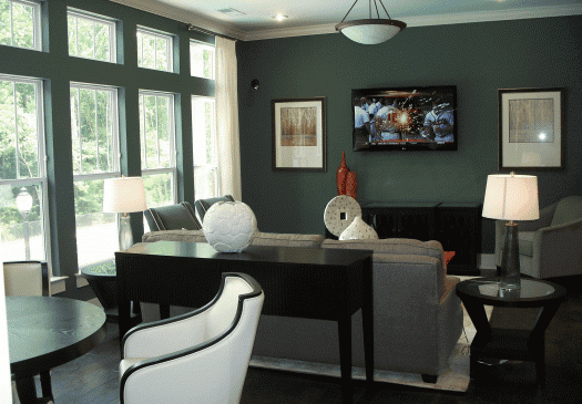 Modern living room with large windows and wall-mounted TV