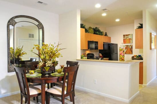 Modern dining area with open kitchen and breakfast bar
