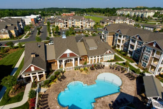 Aerial view of apartment complex with swimming pool