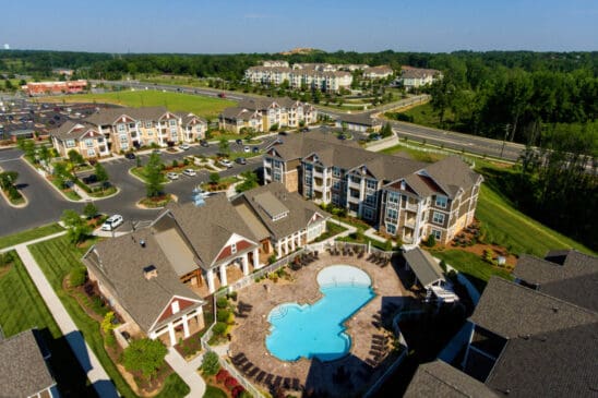 Aerial view of apartment complex with swimming pool