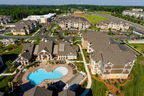 Aerial view of apartment complex with swimming pool