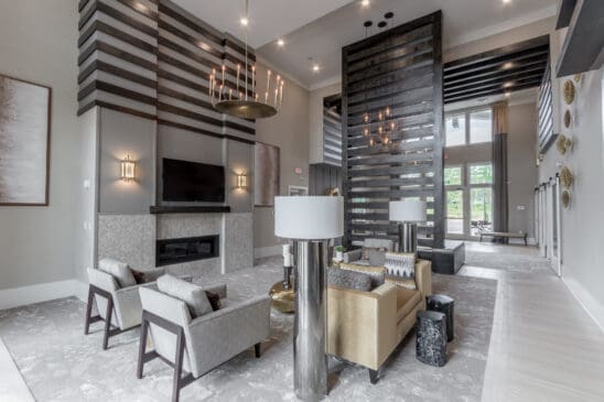 Modern apartment lobby with fireplace and seating area