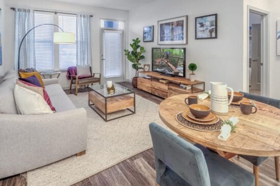 Modern living room with sofa, TV, dining table