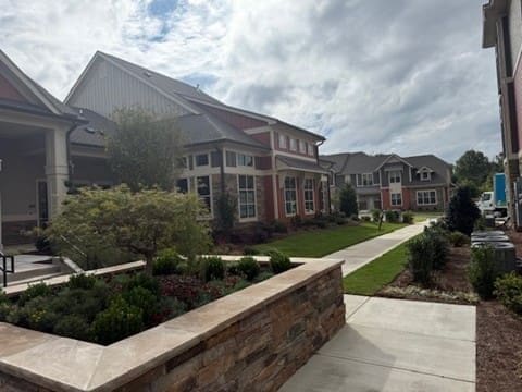 Modern apartment buildings with landscaped walkway and courtyard