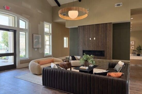 Modern living room with curved sofa and fireplace