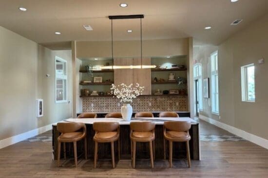 Modern dining room with long table and leather chairs