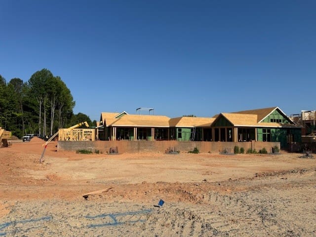 Commercial building under construction on dirt lot